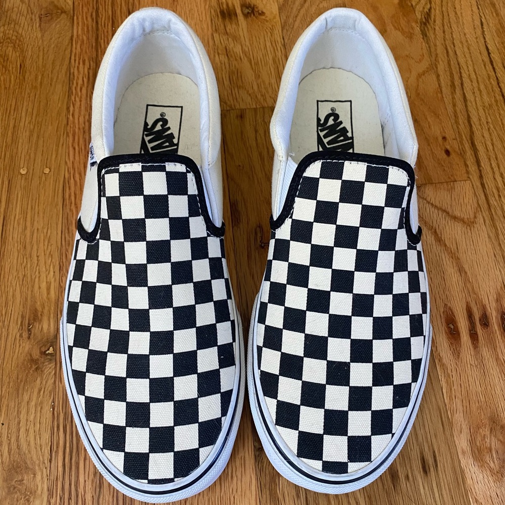 Slip on black and white checkered Vans